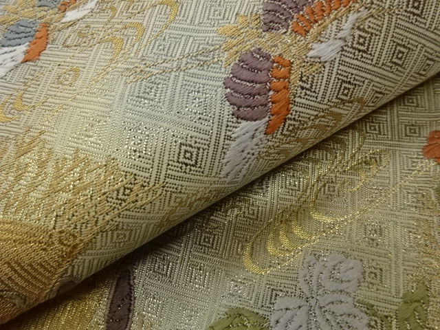  笹に蔓草・鶴・流水模様織出し袋帯